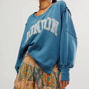This is a Free People We The Free Camden graphic sweatshirt in blue with "London